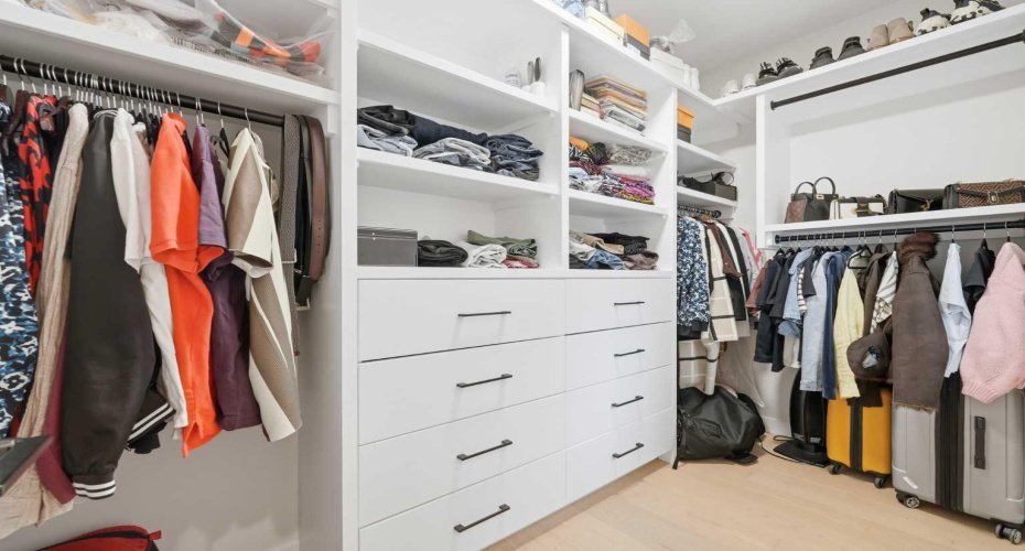 Custom walk-in closet provides exceptional organization and MDF storage solutions.