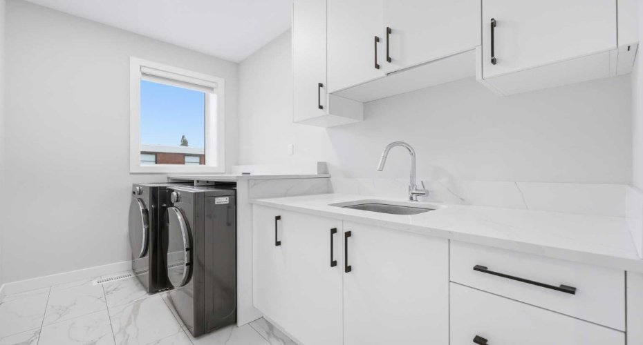 Dedicated laundry room adds convenience exactly where it is needed most.