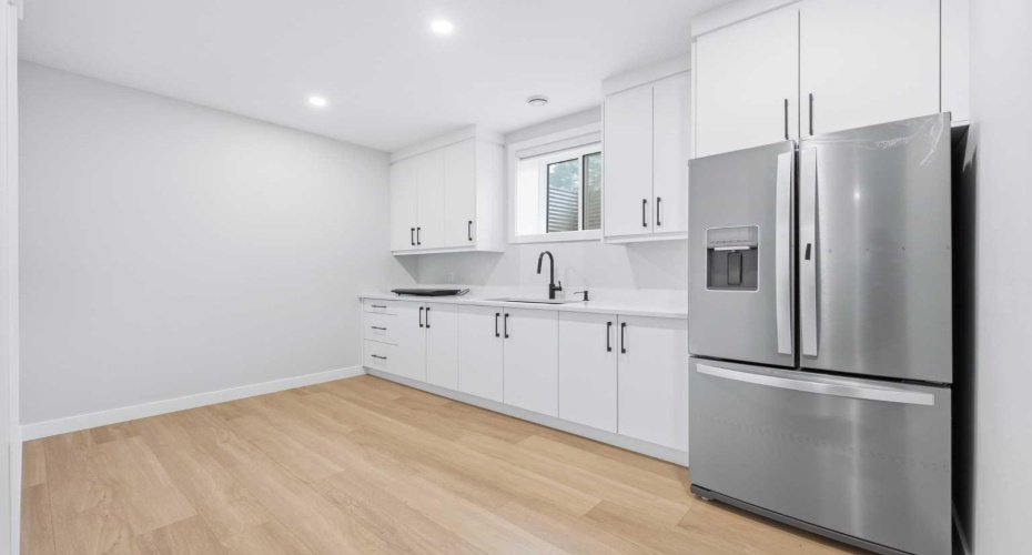 Additional kitchenette creates flexibility for multi-generational households or guests.