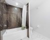 Stylish lower-level bathroom finished to the same high standard found throughout the home.