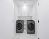 Separate laundry facilities add practicality and independence to the lower level.