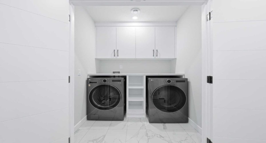 Separate laundry facilities add practicality and independence to the lower level.