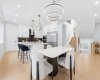 Open-concept design seamlessly connects cooking, dining, and entertaining spaces.
