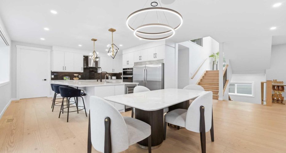 Open-concept design seamlessly connects cooking, dining, and entertaining spaces.