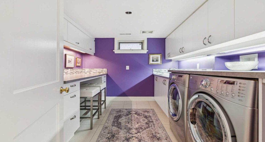 Pretty and Practical Laundry room with ++ Counter and Storage space