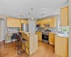 There's real function packed in here: a corner pantry, a built-in desk for homework or meal planning, and enough counter space to have more than one cook in the kitchen.