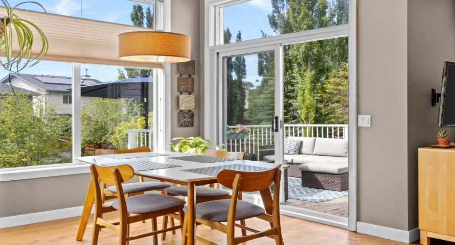 A sliding door opens straight onto the upper deck, so dinner drifts outside the moment the weather says yes.