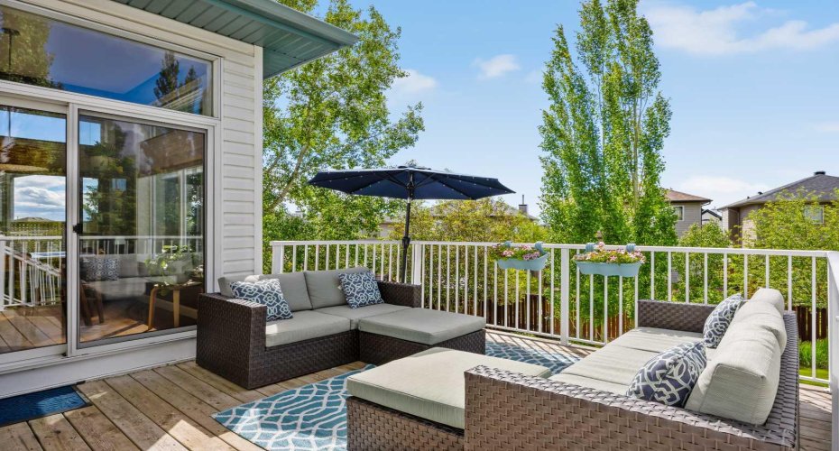 Surrounded by mature trees with the neighbourhood tucked quietly beyond, this deck feels more like a treehouse escape than a suburban backyard.