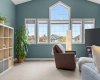 Upstairs, the vaulted bonus room faces front and fills beautifully with natural light — the kind of space that quietly becomes whatever your family needs it to be.