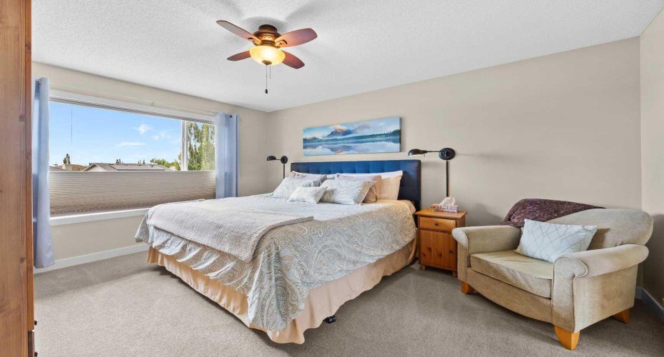 The primary bedroom is a proper retreat — generously sized, filled with soft natural light, and calm from the moment you walk in.