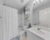 A crisp 4-piece bathroom serves the two additional bedrooms — bright, clean, and ready for the morning rush.