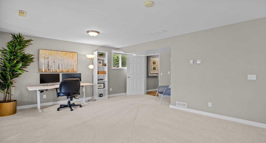 The walkout basement is built for the life that happens when everyone comes over — a generous rec room with fresh carpet (2026), big bright windows, and direct access to the backyard.