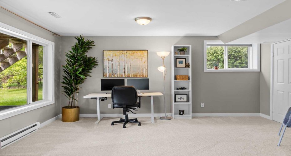 Above-grade windows and the walkout make this one of those rare basements that never actually feels like a basement.