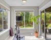 Sunlight on three sides and a sliding door straight to the patio — cool-down laps around the backyard are entirely optional but highly recommended.