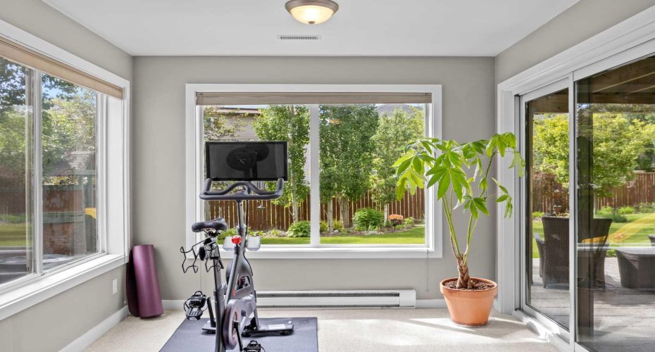 Sunlight on three sides and a sliding door straight to the patio — cool-down laps around the backyard are entirely optional but highly recommended.