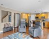 The main floor flows effortlessly from living room to kitchen — an open layout designed around how a family actually lives, where whoever's cooking is never left out of the conversation.