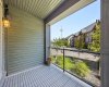 A large private patio overlooking landscaped greenery — the kind of outdoor space that earns its keep in every season.
