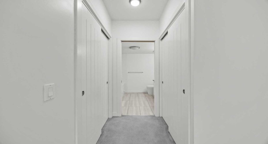 Double closets on both sides lead straight through to the ensuite — storage that's actually thought through.