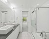 he 5-piece ensuite delivers — his and hers sinks, a tiled stand-up shower, and a soaker tub, all finished in the same clean palette as the rest of the unit.