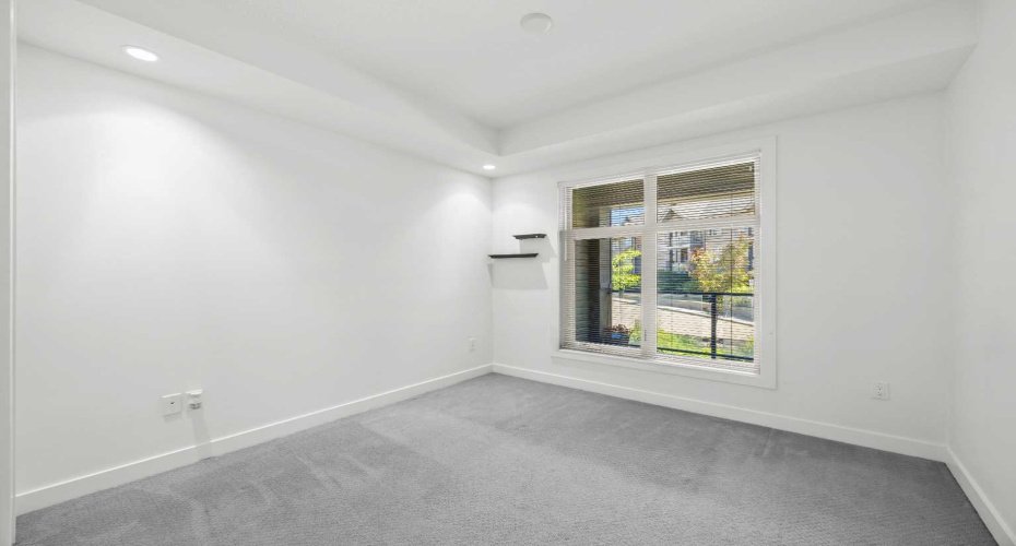 On the opposite side of the unit from the primary, the second bedroom is ideal as a guest room, a kids' bedroom, or a home office.