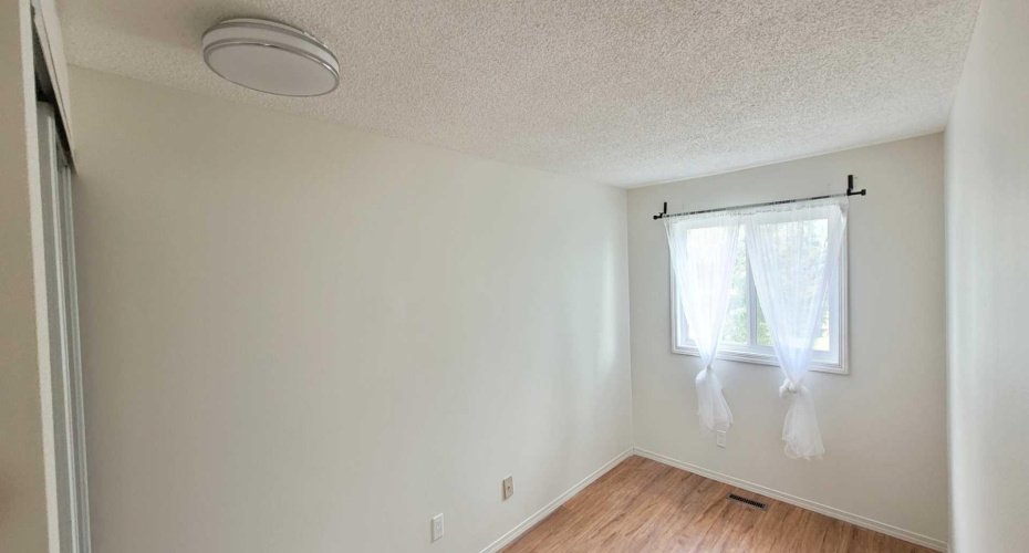 Newly paint 3rd bedroom 3rd bedroom with mirror closet doors.