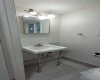Main floor half bathroom with brand new toilet.