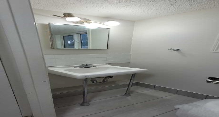 Main floor half bathroom with brand new toilet.