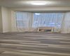 Brand new paint and vinyl planks in dining room.