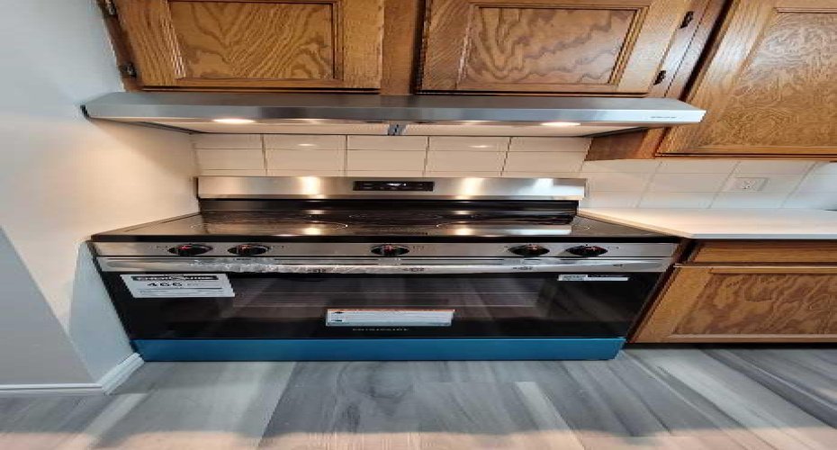 Brand new stainless steel range and hood fan.