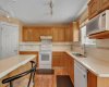 Kitchen has plenty of cabinetry & corner pantry.