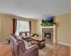Bright living room with gas fireplace!