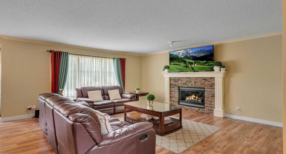 Bright living room with gas fireplace!