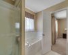 Ensuite has walk-in shower & soaker tub.
