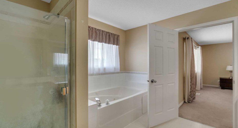 Ensuite has walk-in shower & soaker tub.