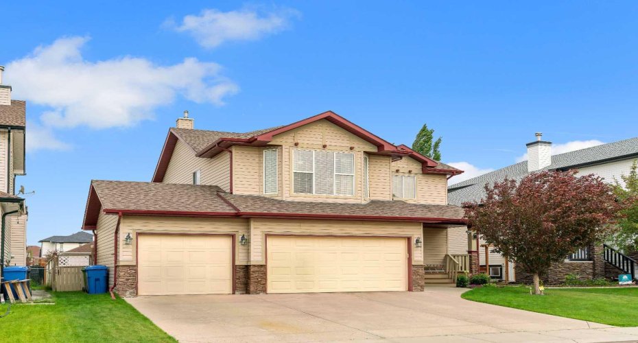 Triple attached garage with driveway parking!