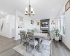 Oversized windows fill the living room with abundant natural light, creating an airy and welcoming space...