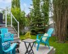 From the deck, steps lead down to a beautifully treed yard.