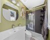 A crisp, modern bathroom with a floating vanity, walk-in glass shower, and a cheerful pop of colour. Clean lines and thoughtful finishes make everyday routines feel like a getaway.