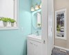 A crisp two-piece bath in a soft aqua palette