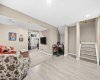 Room to Play, Room to Relax The fully developed lower level opens up to a spacious rec area — comfortable seating, space for games, and room for a home gym. Endless flexibility for family life.