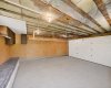 This photo has been edited to remove the owners contents. Note that  in person the white work bench is not the full length of the wall