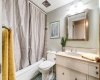 The 4 piece bathroom has character thanks to the tile flooring