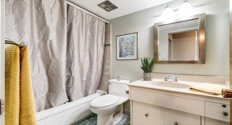 The 4 piece bathroom has character thanks to the tile flooring