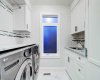 Laundry is conveniently located on 2nd level, and finished with full cabinetry and a sink.
