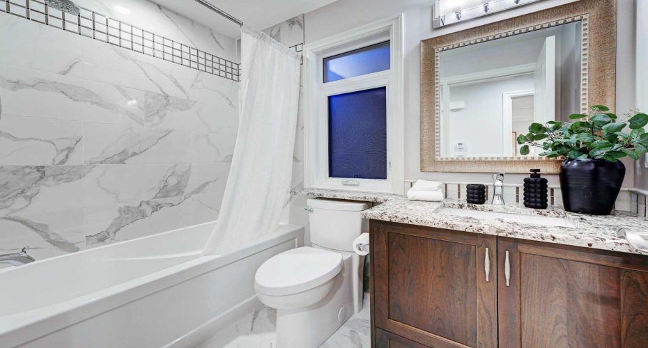 4 pc bath on 2nd level with marble accents.