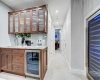 Wet bar in basement plus a 125 bottle wine fridge.