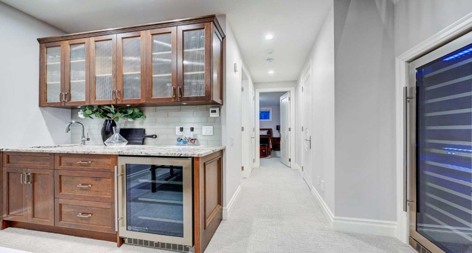 Wet bar in basement plus a 125 bottle wine fridge.