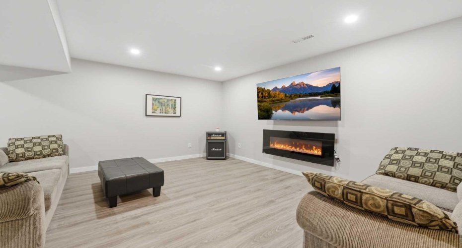 Fully finished basement with spacious rec room with new LVP flooring