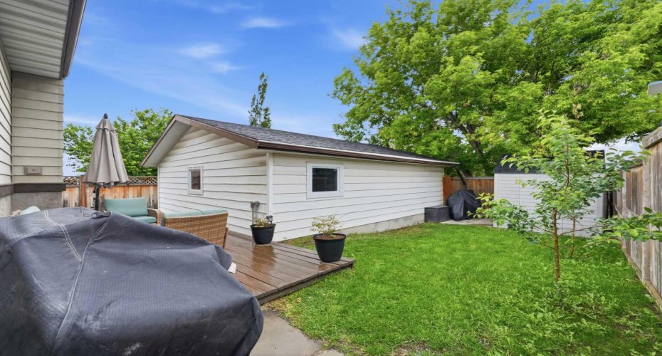 Large back yard with double detached garage