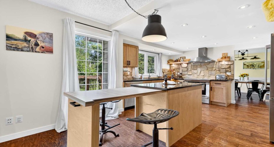 Unique custom island can open for casual dining.